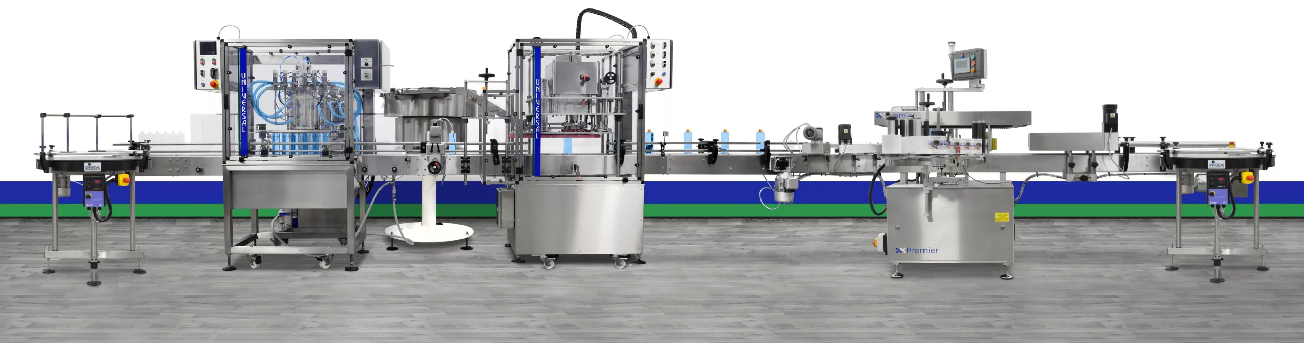 Complete liquid filling, capping and labelling production line with rotary infeed and outfeed tables